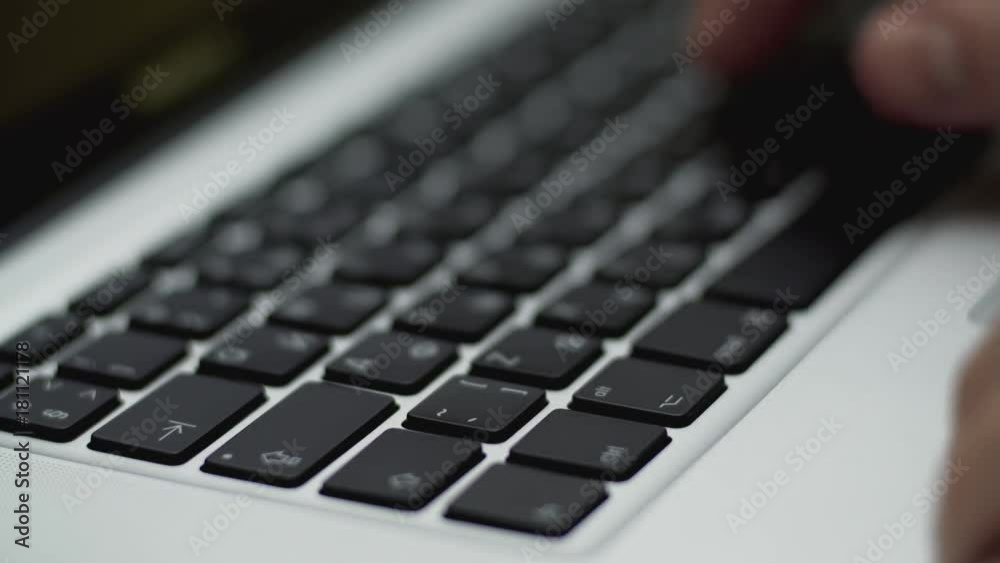 Hands writing on laptop keyboard, close up view in 4k resolution. 4k, UHD shot. Concept of network communications or online shopping Hands writing on laptop keyboard, close up view in 4k resolution. 4k, UHD shot. Concept of network communications or online shopping