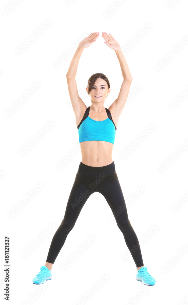 Beautiful young woman doing exercises, isolated on white