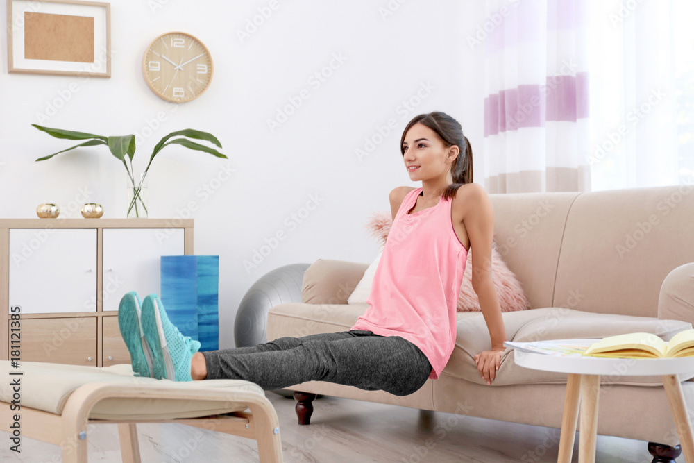 Beautiful young woman doing exercises at home Beautiful young woman doing exercises at home