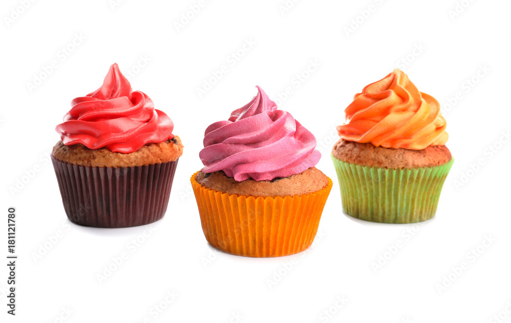 Tasty colorful cupcakes on white background