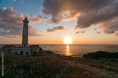 Seascape with lighthouse and sunset at sunset on Ustica island in Meditteraneo,