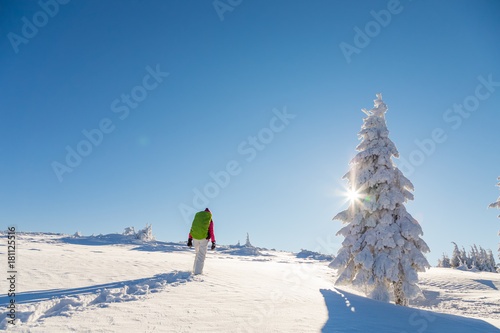 Girl snowshoeing on a sunny day photo