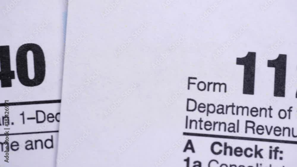 Tax Forms 1040, 1120, 1120-w, 1065, W-4. Extreme close up.
