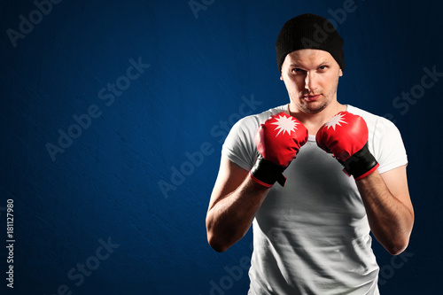 Young boxer sportsman in red sport suit сopy space for text © Aliaksandr Marko