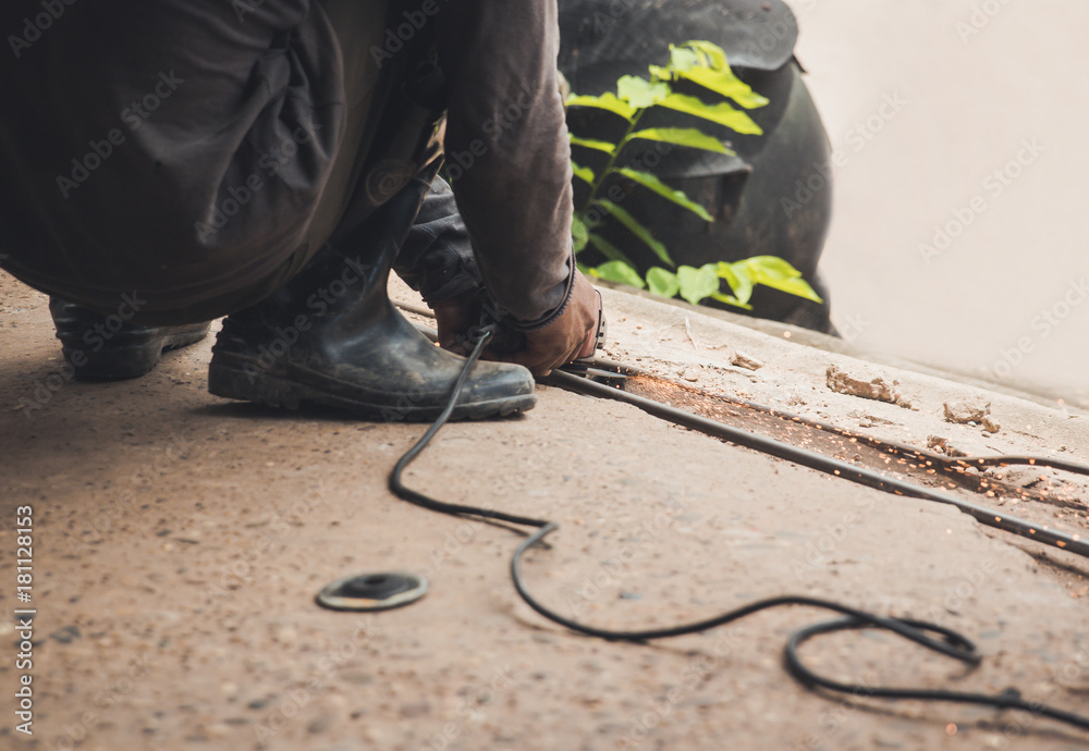 Welder welding steel and sparks metal Welder welding steel and sparks metal