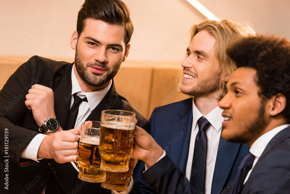 businessmen drinking beer in bar businessmen drinking beer in bar