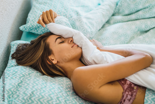 Woman sleeping in bed photo