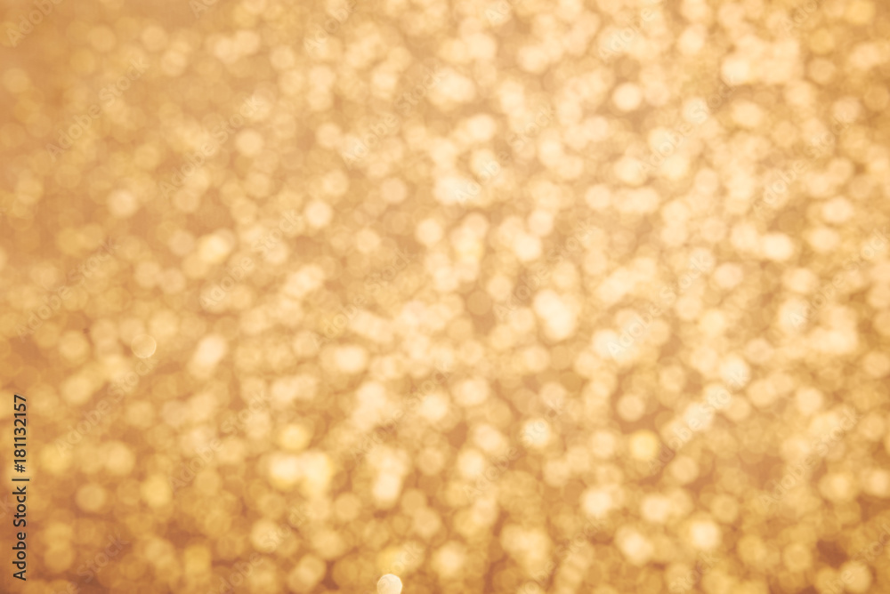 Golden glitter texture. Christmas expensive abstract background. Blured bokeh. Golden glitter texture. Christmas expensive abstract background. Blured bokeh.