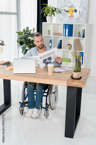 disabled man reading newspaper © LIGHTFIELD STUDIOS