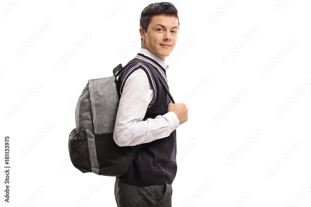 Teenage student with a backpack looking at the camera and smiling