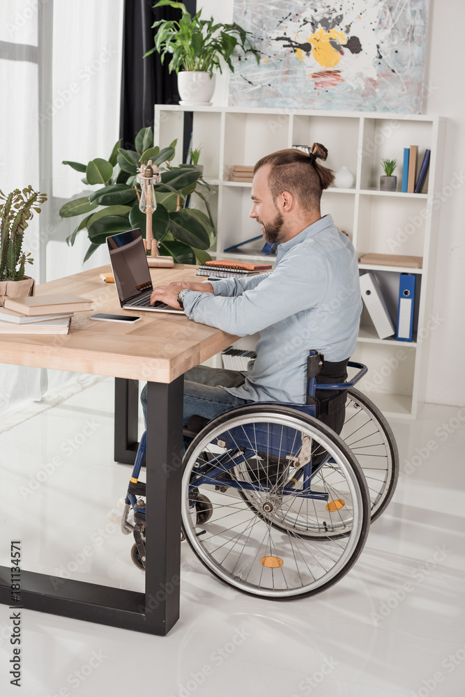 disabled man using laptop disabled man using laptop