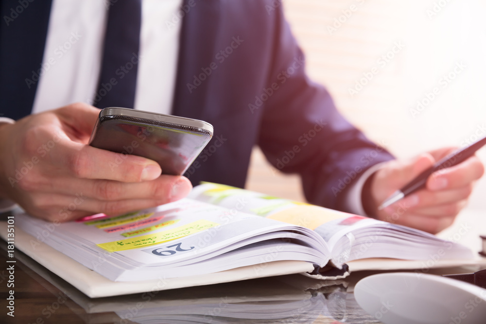 Businessperson Using Mobile Phone Businessperson Using Mobile Phone