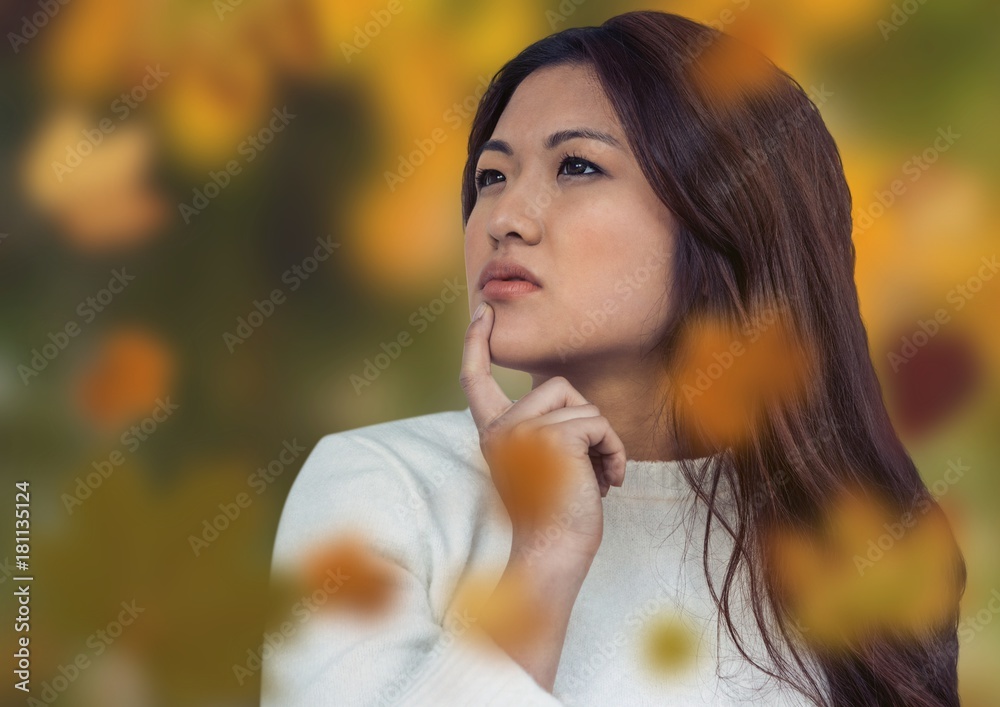 Woman's face in forest with leaves Woman's face in forest with leaves