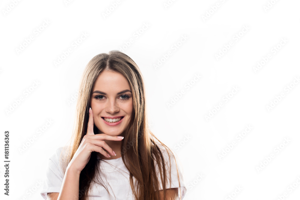 smiling girl touching face with hand smiling girl touching face with hand