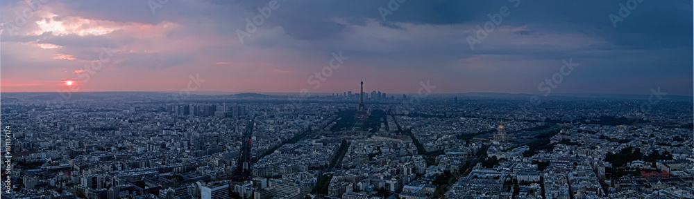 Aerial view at sunset of Eiffel Tower and La Defense in background, Paris, France