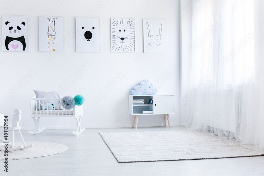 Fototapeta premium Baby's bedroom with white furniture