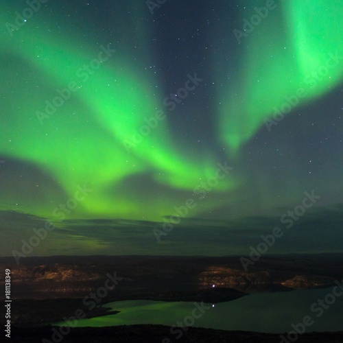 Aurora in the sky and the reflection in the water.