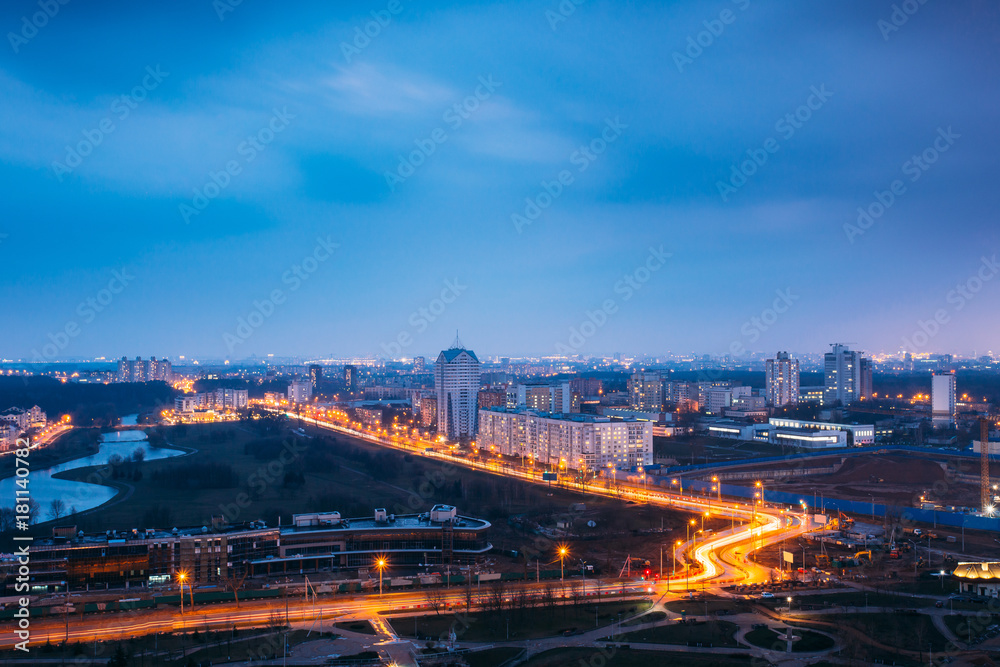 Minsk, Belarus. Aerial Cityscape In Bright Blue Hour Evening And Yellow Illumination Spring