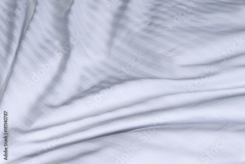 Top view of white bedding striped textile, Elegant textile on bed