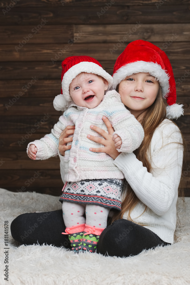 cute happy children with santa hats cute happy children with santa hats
