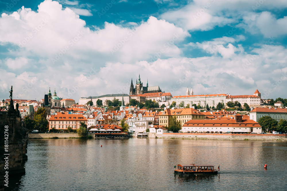 Prague, Czech Republic. Sightseeing Boat Sailing Along Vltava River On Background Upper Town. Prague, Czech Republic. Sightseeing Boat Sailing Along Vltava River On Background Upper Town.