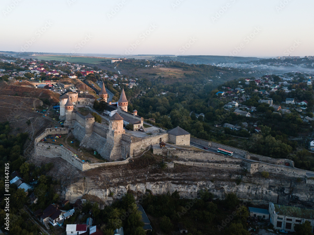 Aerial view of Kamianets-Podilskyi castle in Ukraine. The fortress located among the picturesque nature in the historic city of Kamianets-Podilskyi, Ukraine.