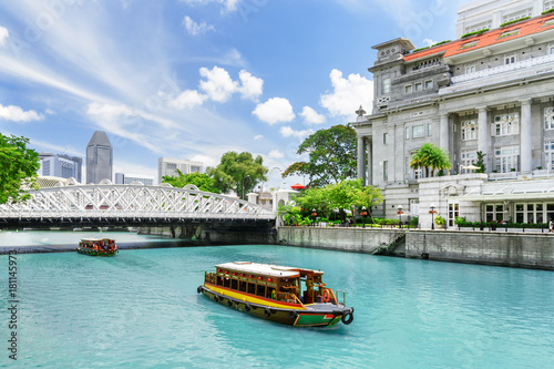 Scenic view of tourist boats sailing along the Singapore River