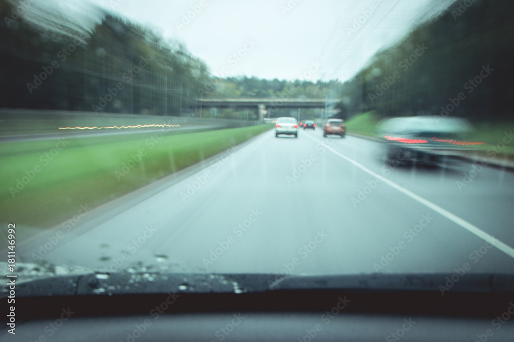 view from the car from the driver's seat. traffic of cars on the road. motion blur view from the car from the driver's seat. traffic of cars on the road. motion blur