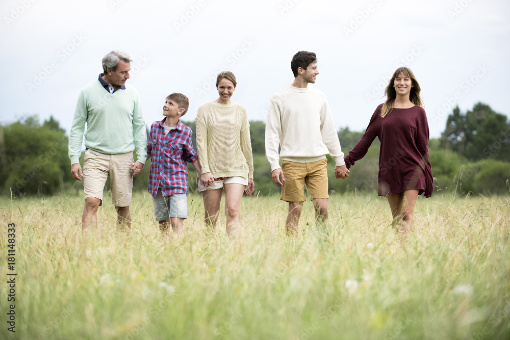 Family walking together in field Family walking together in field