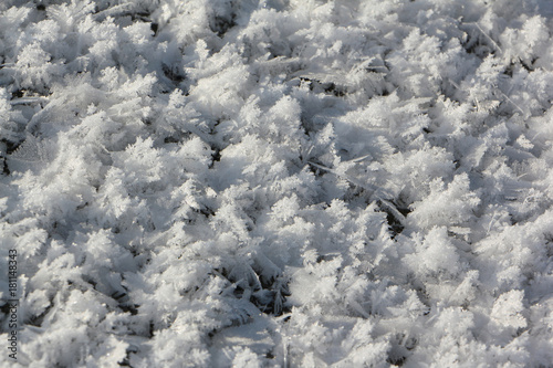 Rime on the ice of the freezing river, natural background. Ob Reservoir, Russia
