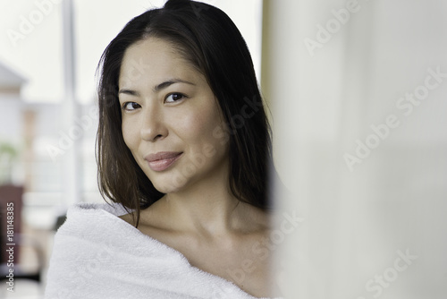Woman wrapped in towel, portrait