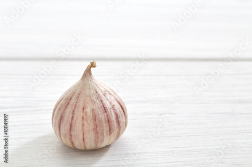 Fresh healthy garlic on white table