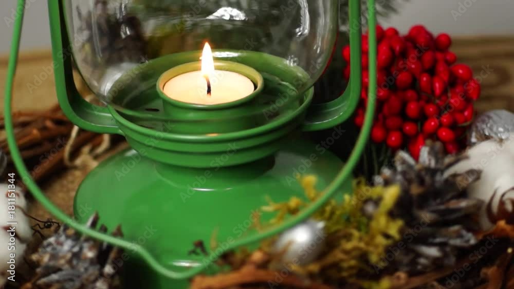 Looping. Christmas candles flicker alongside Christmas bells and greenery with white Christmas lights in the soft-focused background. Merry Christmas! Looping. Christmas candles flicker alongside Christmas bells and greenery with white Christmas lights in the soft-focused background. Merry Christmas!