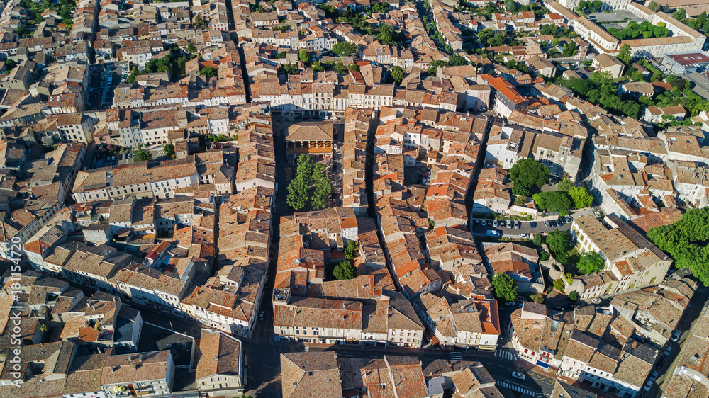Aerial top view of residential area houses roofs and streets from above, old medieval town background, France
