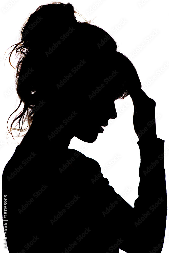 silhouette of a thoughtful sad woman with hand near her forehead on white  isolated background, the concept life problems and depression Stock Photo