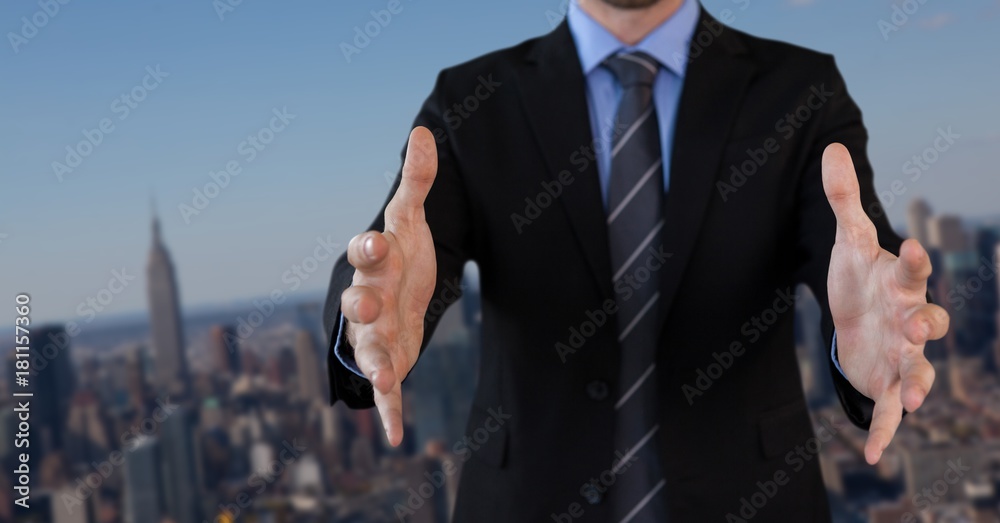Businessman with hands palm open in city Businessman with hands palm open in city