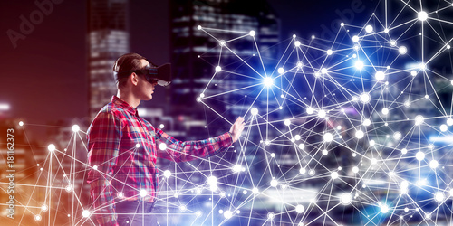 Guy wearing checked shirt and virtual mask reaching hand to feel his way