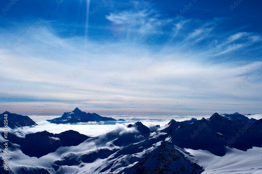 beautiful view of clouds crossing the mountain ridge. awesome mountain