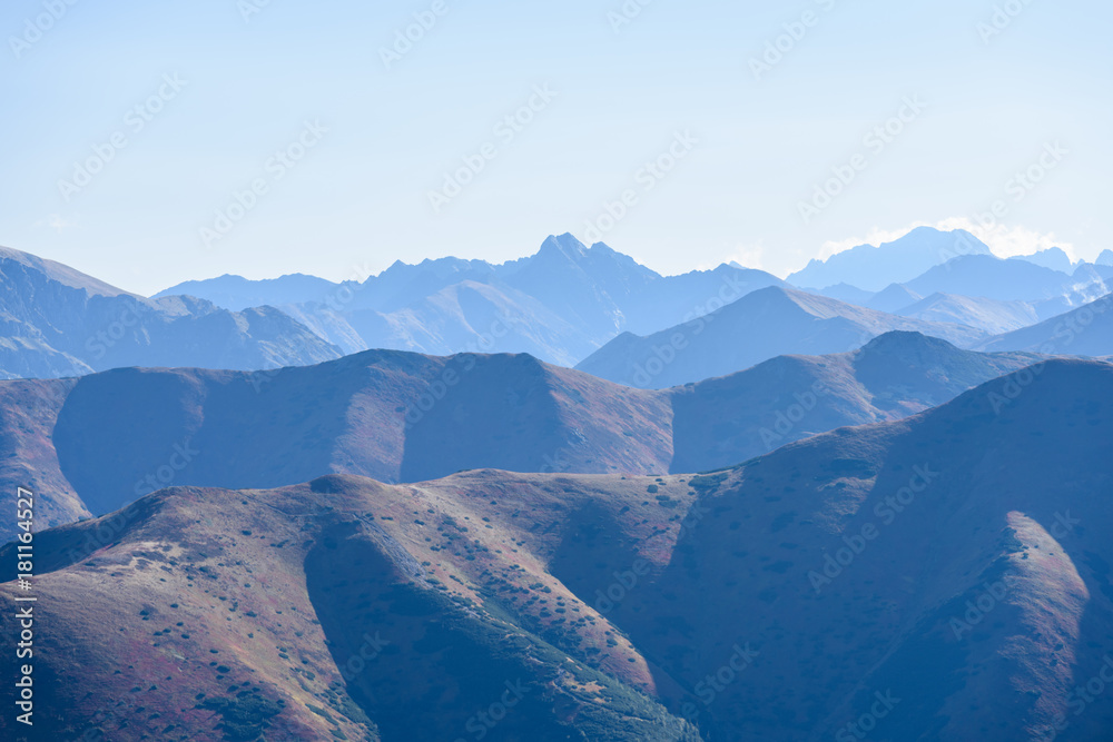 mountain tops in  autumn covered in mist or clouds