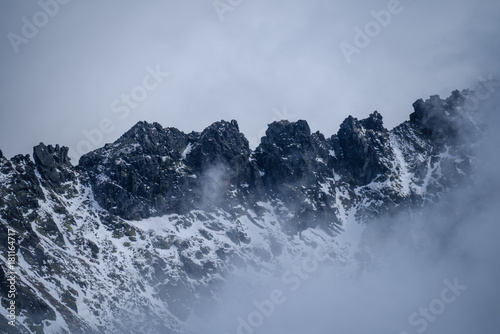 mountain tops in winter covered in snow © Martins Vanags