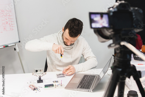 video tutorial creation filming backstage concept. passionate about work. Assembly of mechatronics. photo