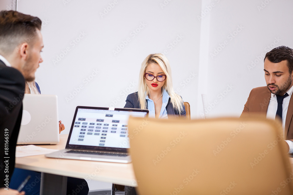Business people at meeting in the conference room. They are discussing new projects Business people at meeting in the conference room. They are discussing new projects