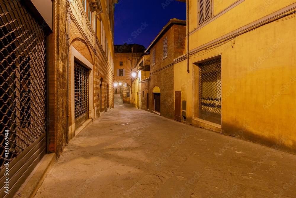 Siena. Old city street at night.