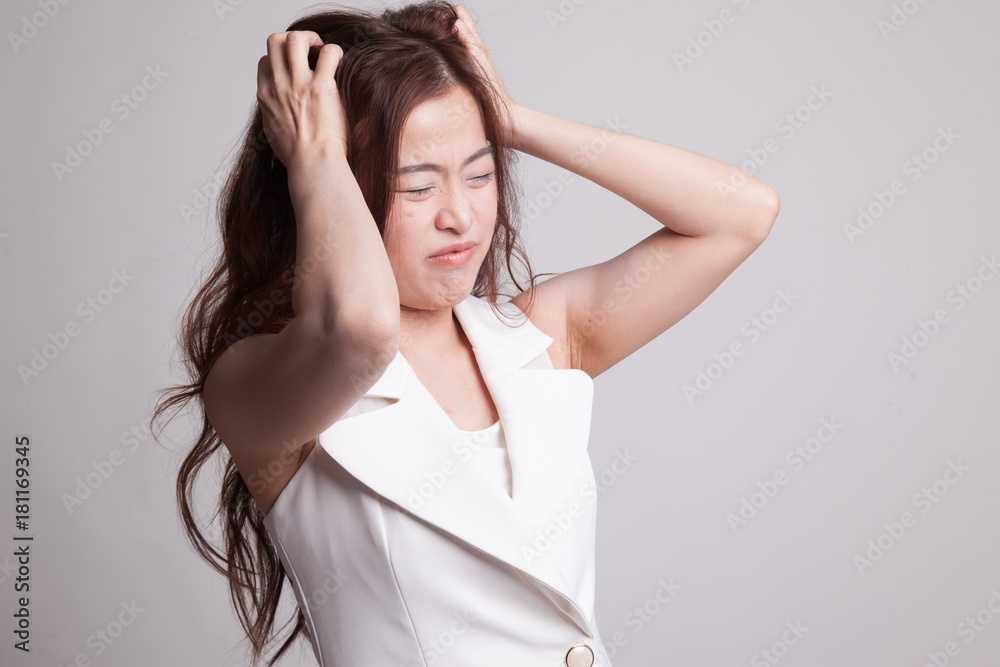 Stressed young Asian businesswoman scream out. Stressed young Asian businesswoman scream out.