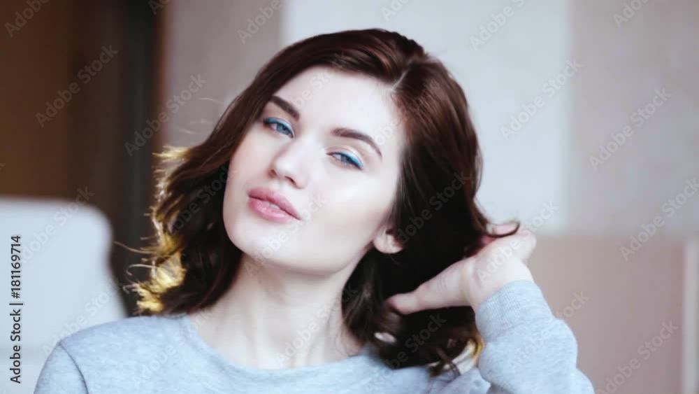 Closeup of beautiful brunette girl posing and smiling Closeup of beautiful brunette girl posing and smiling