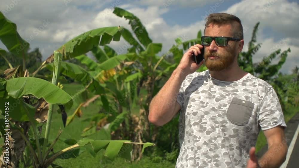 Man walking in exotic place and quarrelling on cellphone, steadycam shot, slow motion shot at 240fps
Man walking in exotic place and quarrelling on cellphone, steadycam shot, slow motion shot at 240fps