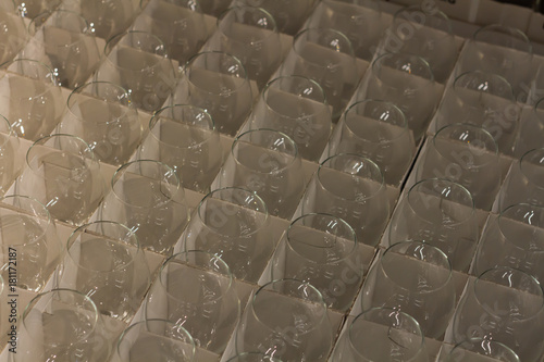 lot clear wine glasses stored in a cardboard box in the warehouse, a wholesale store