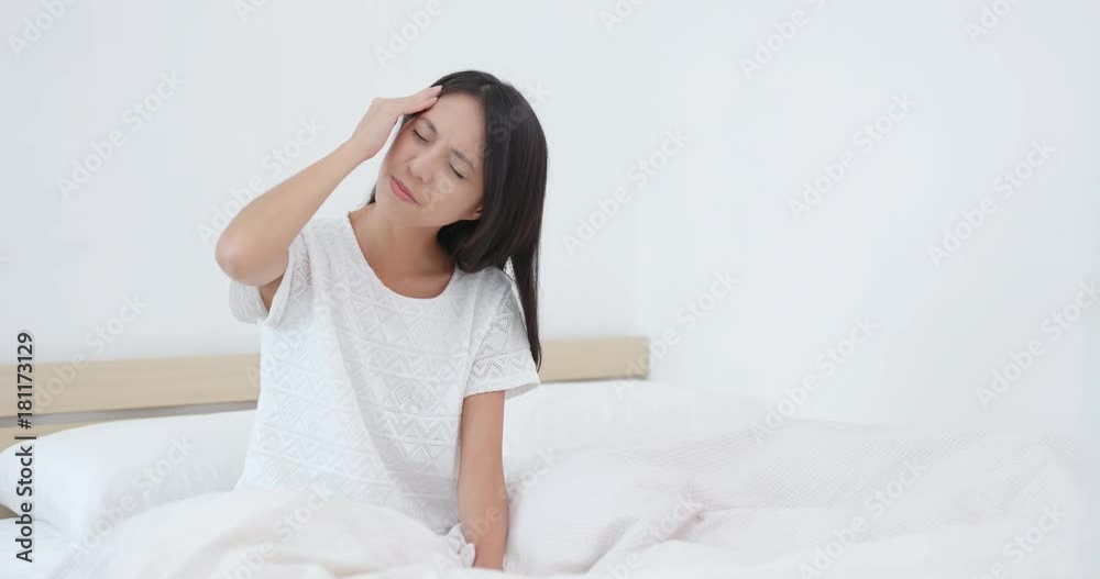 Woman suffer from headache on bed Woman suffer from headache on bed