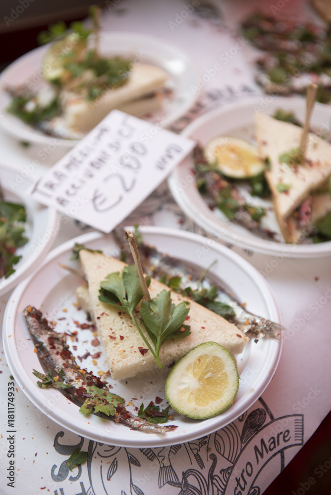Raw sardines for aperitifs at fish market Catania Sicily Raw sardines for aperitifs at fish market Catania Sicily