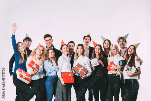 Group of people having a party with gift boxes.